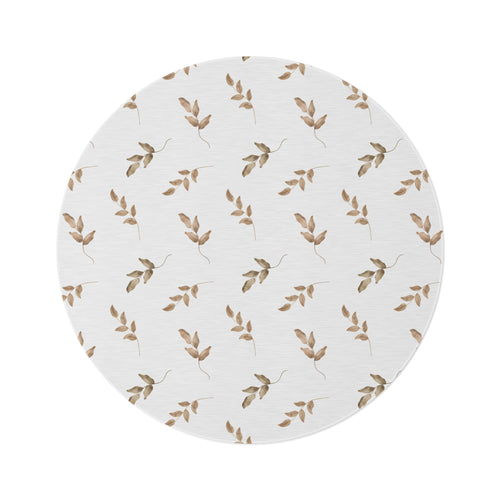 Linen Leaf round nursery rug on a baby room floor