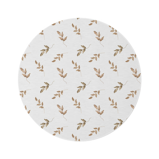 Linen Leaf round nursery rug on a baby room floor