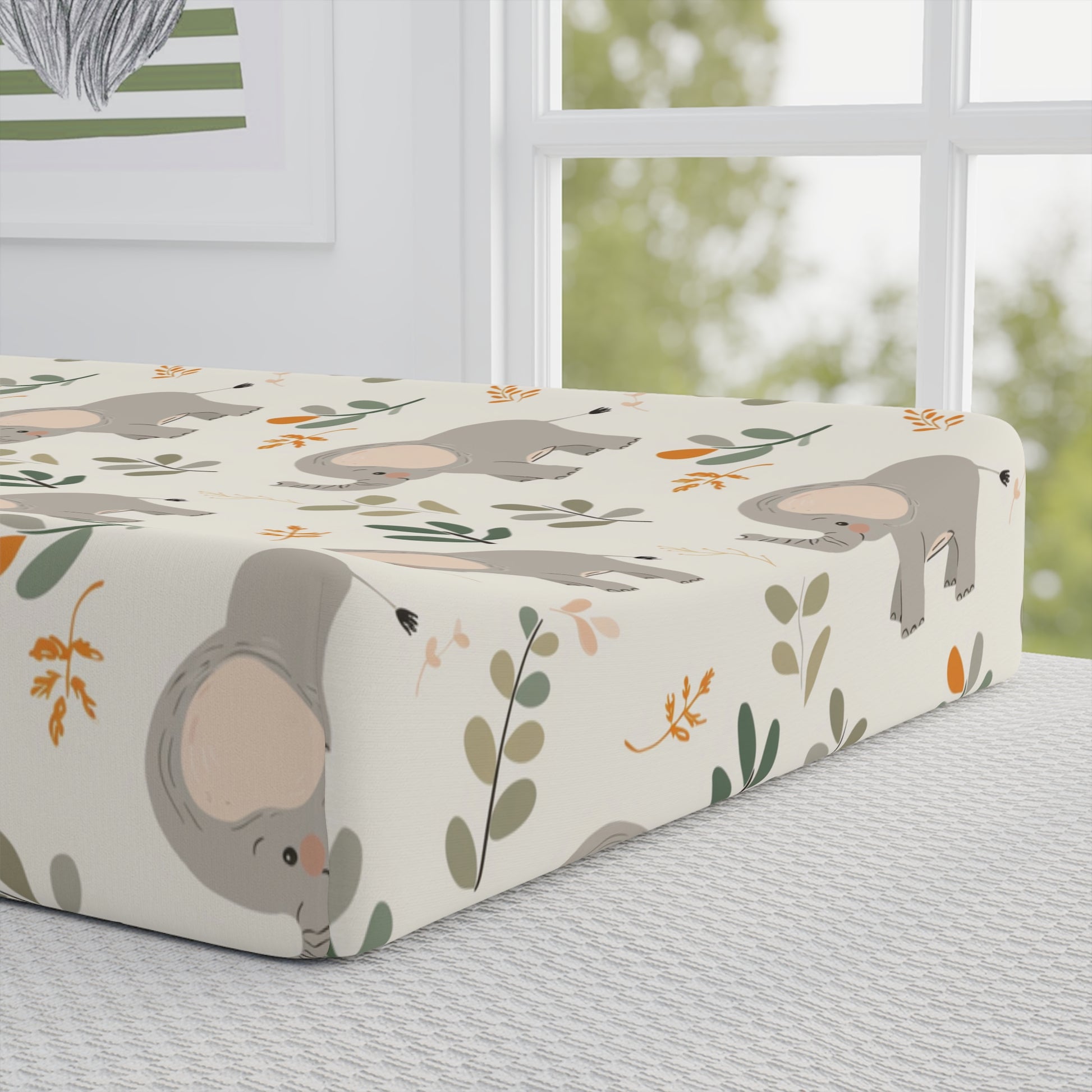Close detail of the Little Elephants print on the changing pad cover