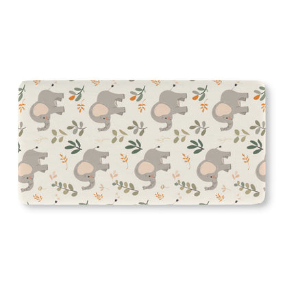 Fitted crib sheet with grey elephants and green leaves on cream