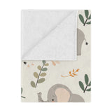 Little Elephants minky baby blanket draped over a crib