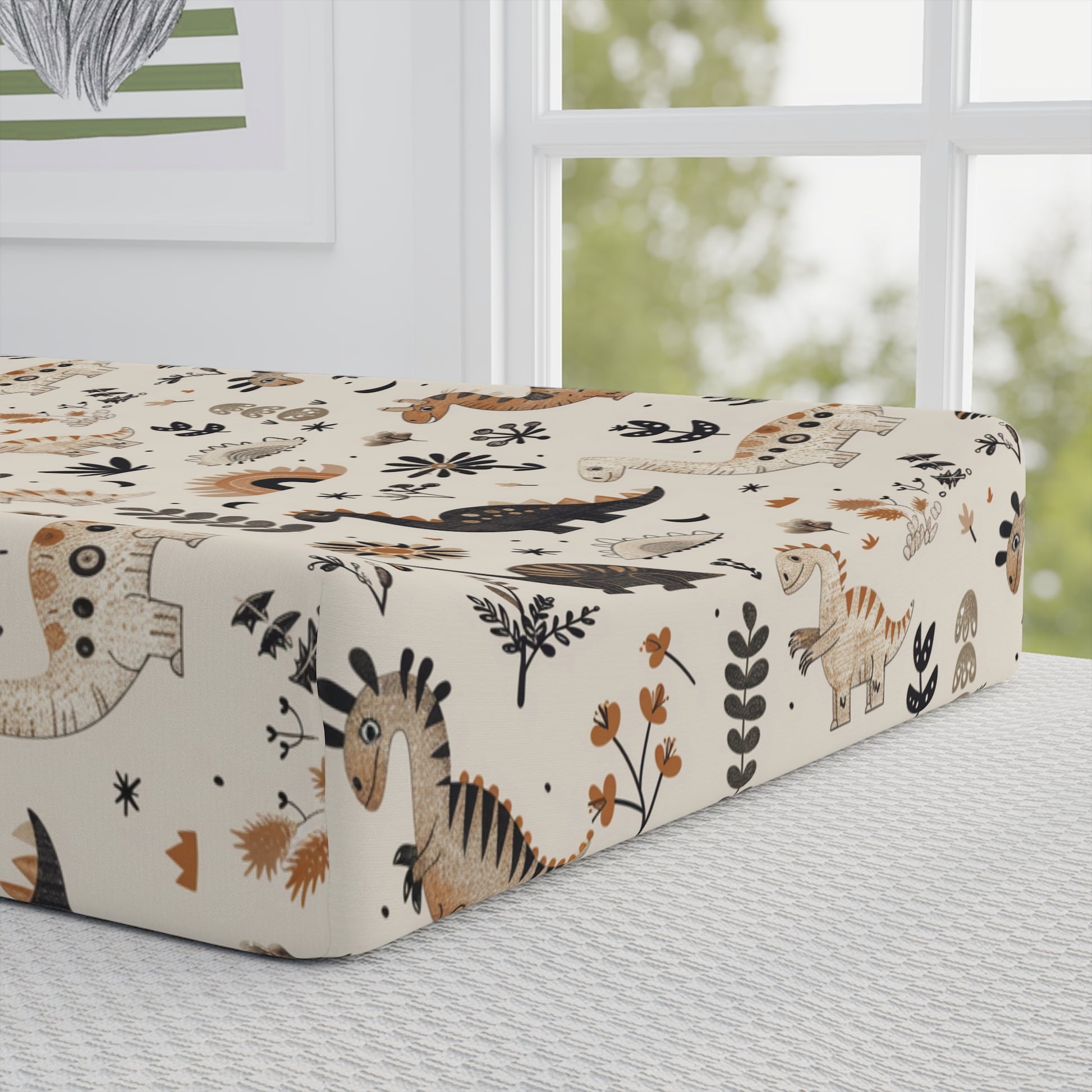 Close detail of the Meadow Dinosaurs print on the changing pad cover