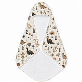 Meadow Dinosaurs hooded baby towel wrapped around a baby