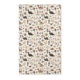 Dinosaur nursery area rug in charcoal, tan and ochre on cream