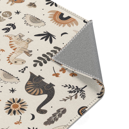 Dinosaur rug in charcoal and ochre for a nursery floor