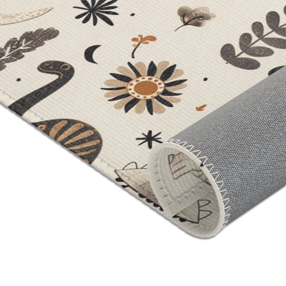Nursery area rug in a charcoal, tan and cream palette