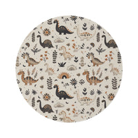 Meadow Dinosaurs round nursery rug on a baby room floor