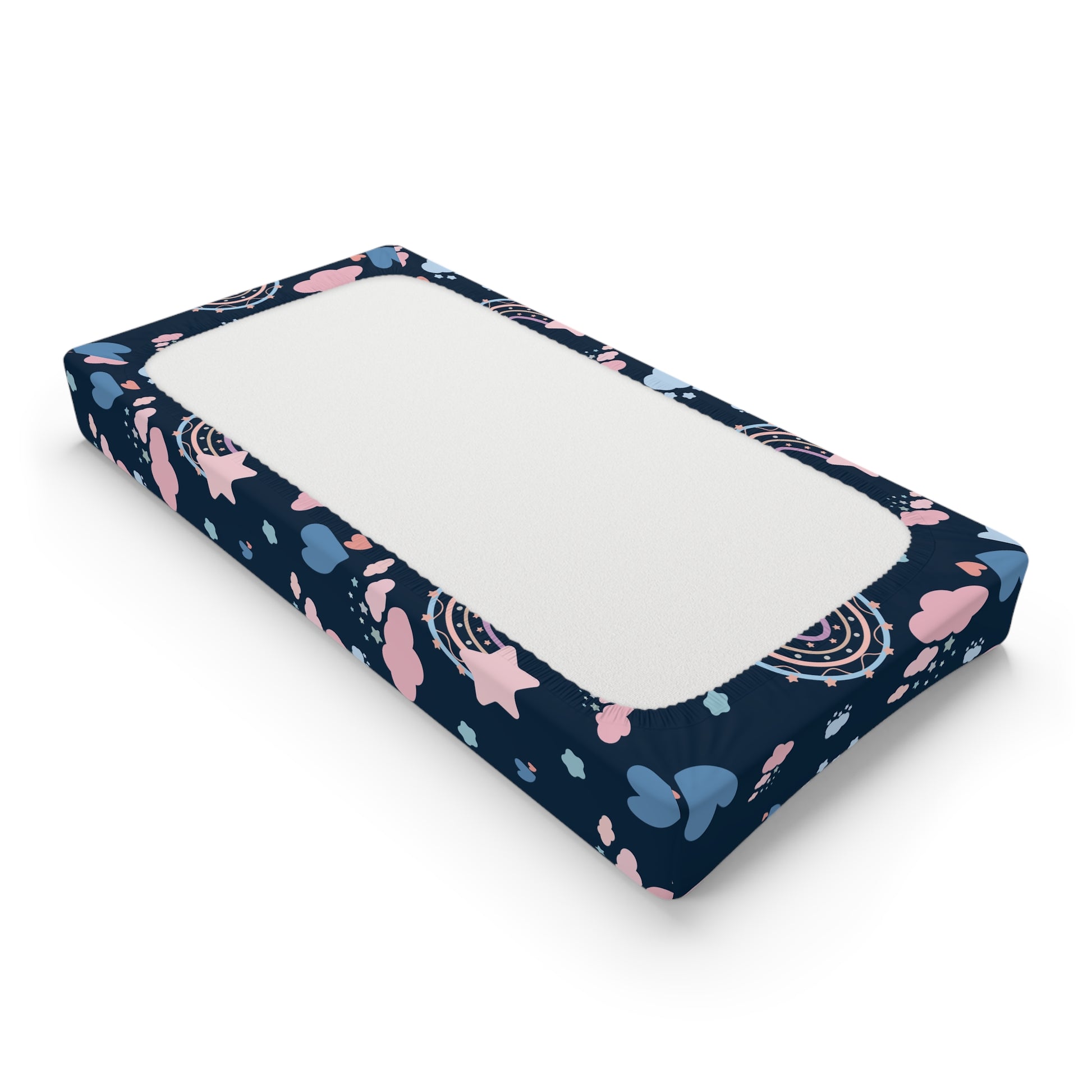 Changing pad cover with pastel rainbows and clouds on navy