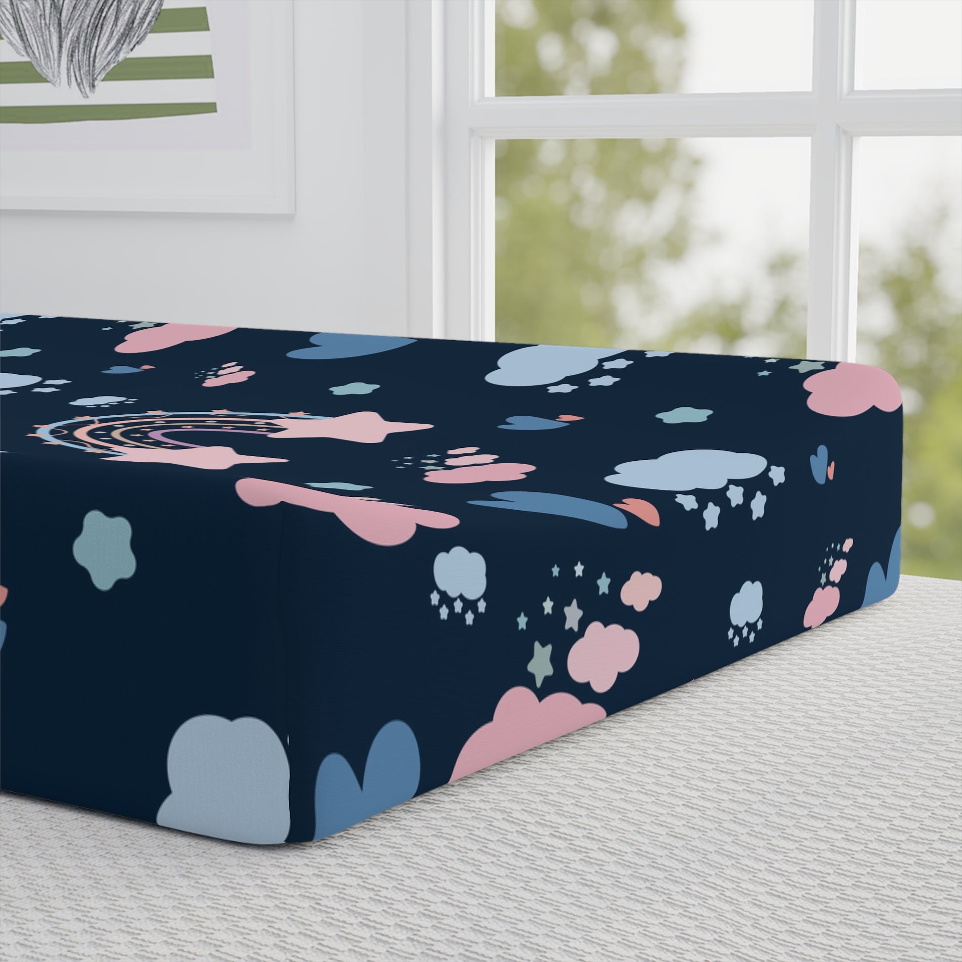 Close detail of the Midnight Rainbow print on the changing pad cover