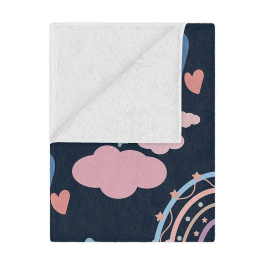 Midnight Rainbow minky baby blanket draped over a crib