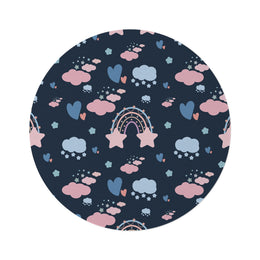 Midnight Rainbow round nursery rug on a baby room floor