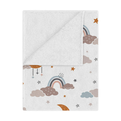 Moonlit Dreams minky baby blanket draped over a crib