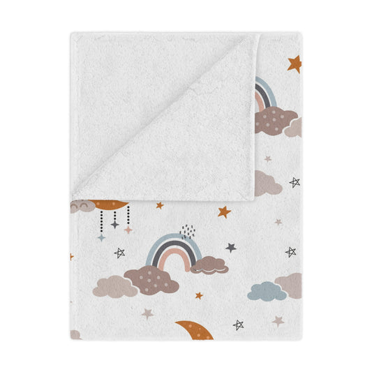 Moonlit Dreams minky baby blanket draped over a crib