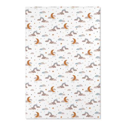 Close detail of the sleeping moons on the nursery area rug
