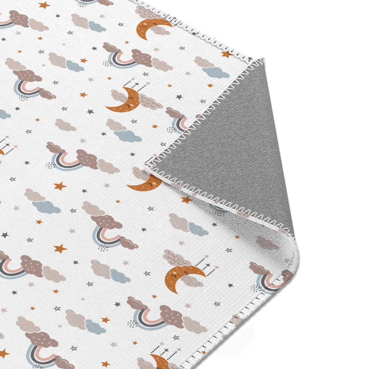 Nursery area rug printed edge to edge with moons and stars