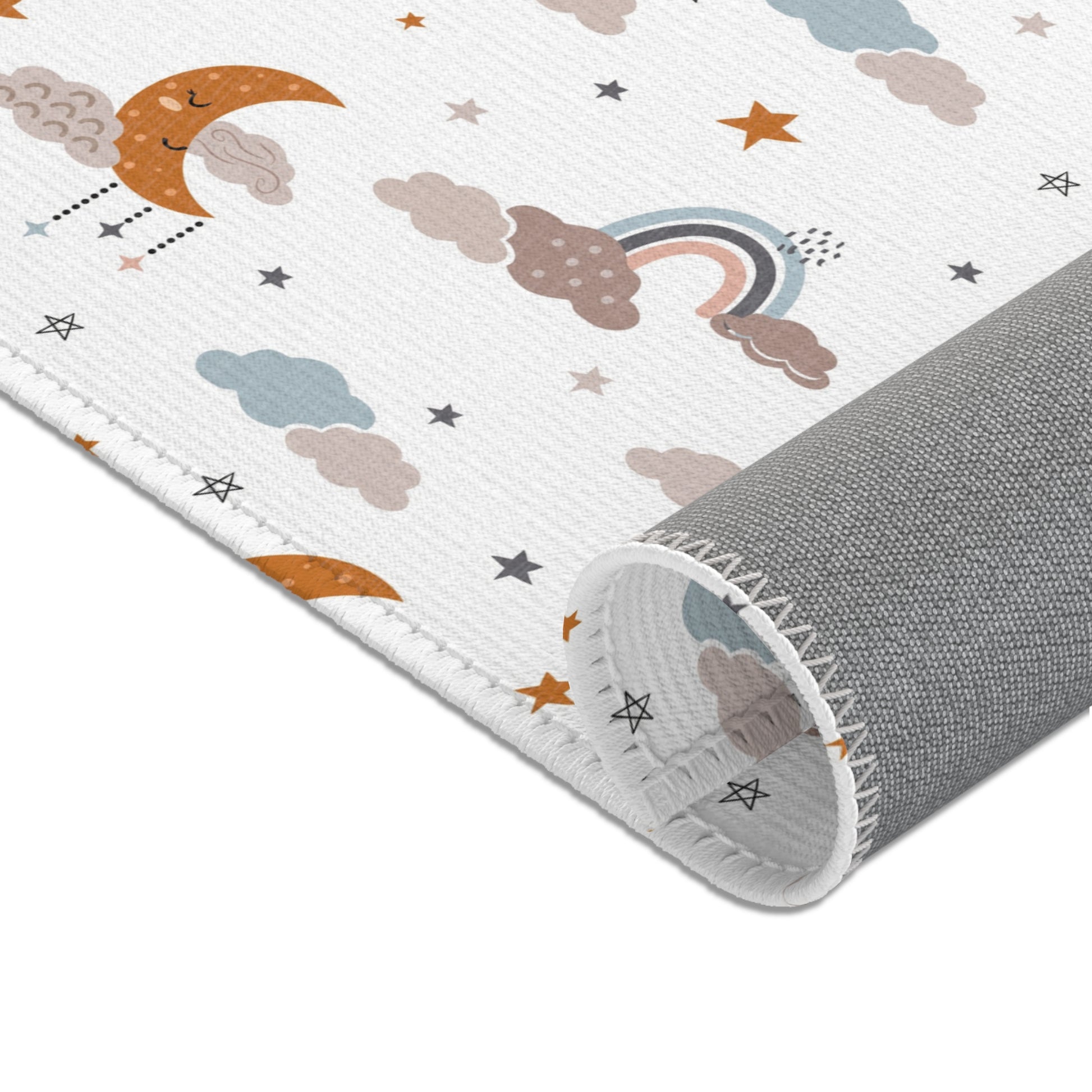 Sleeping moons and small rainbows printed across the area rug