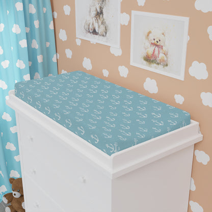 Nautical changing pad cover styled in a coastal nursery