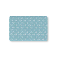 Nautical anchor fitted crib sheet on a nursery crib mattress