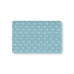 Nautical anchor fitted crib sheet on a nursery crib mattress