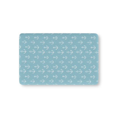 Nautical anchor fitted crib sheet on a nursery crib mattress