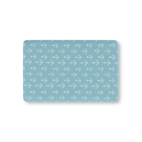Nautical anchor fitted crib sheet on a nursery crib mattress