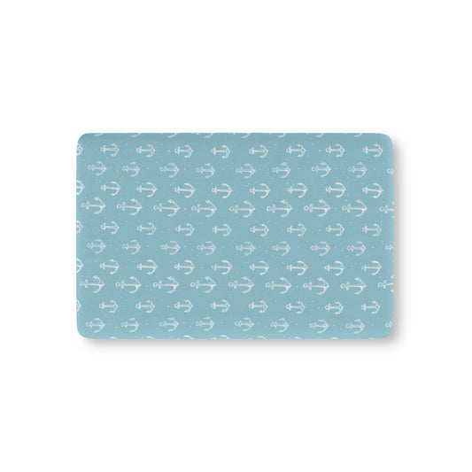 Nautical anchor fitted crib sheet on a nursery crib mattress