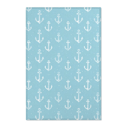 Nautical anchor nursery area rug in a coastal baby room