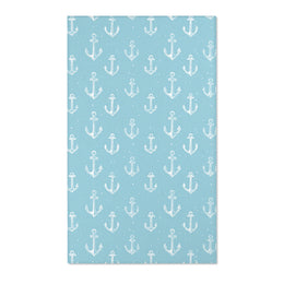 Rectangular teal anchor nursery rug shown from above