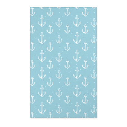 Rectangular teal anchor nursery rug shown from above