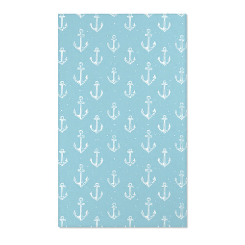 Rectangular teal anchor nursery rug shown from above