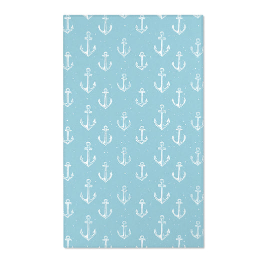 Rectangular teal anchor nursery rug shown from above