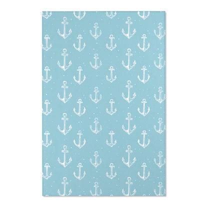 Close-up of the hand-drawn anchor print on a nursery rug