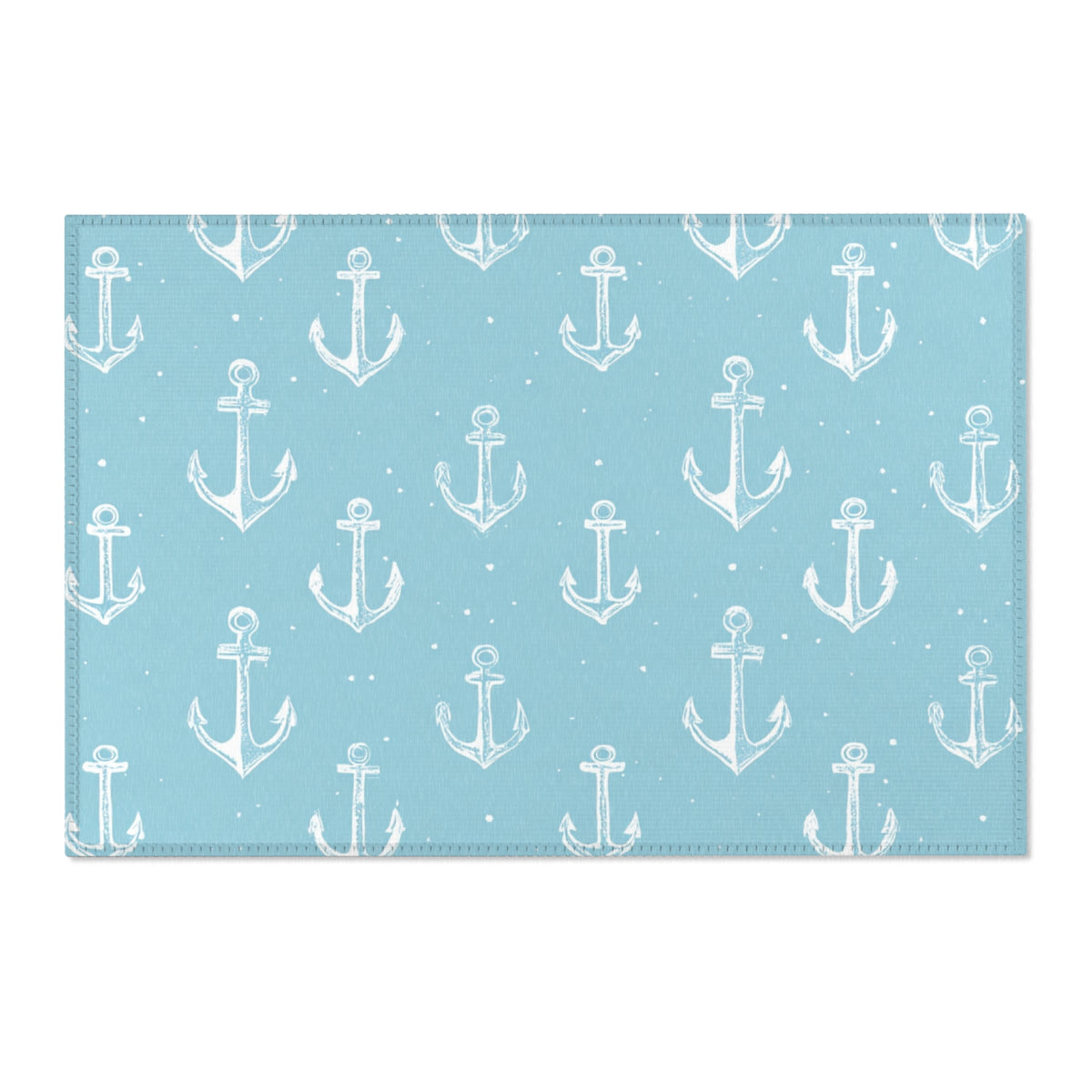 Washable nautical anchor area rug under a nursery crib