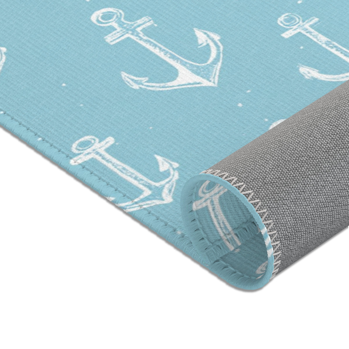 Anchor print baby room rug in a styled coastal nursery