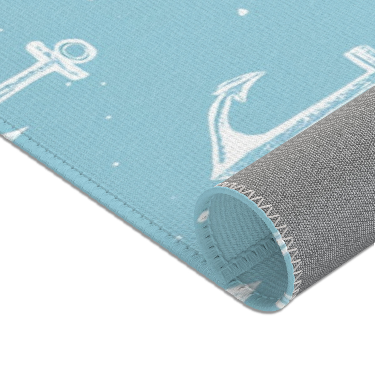 Nautical anchor area rug in a small baby room