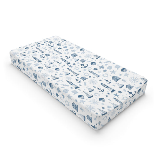 Nautical changing pad cover with lighthouses and sailboats in navy