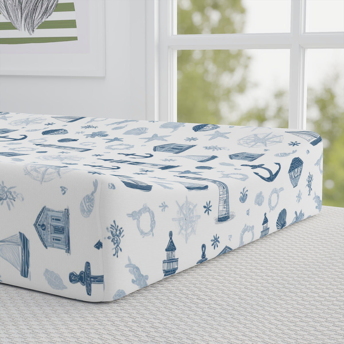 Close-up of the sketched nautical print on a changing pad cover