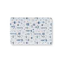 Nautical fitted crib sheet with lighthouses and anchors in navy