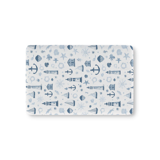 Nautical fitted crib sheet with lighthouses and anchors in navy