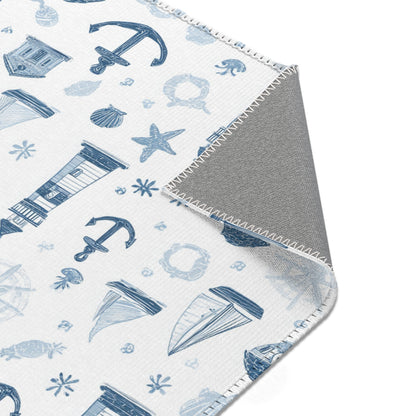 Nautical area rug styled with nursery furniture