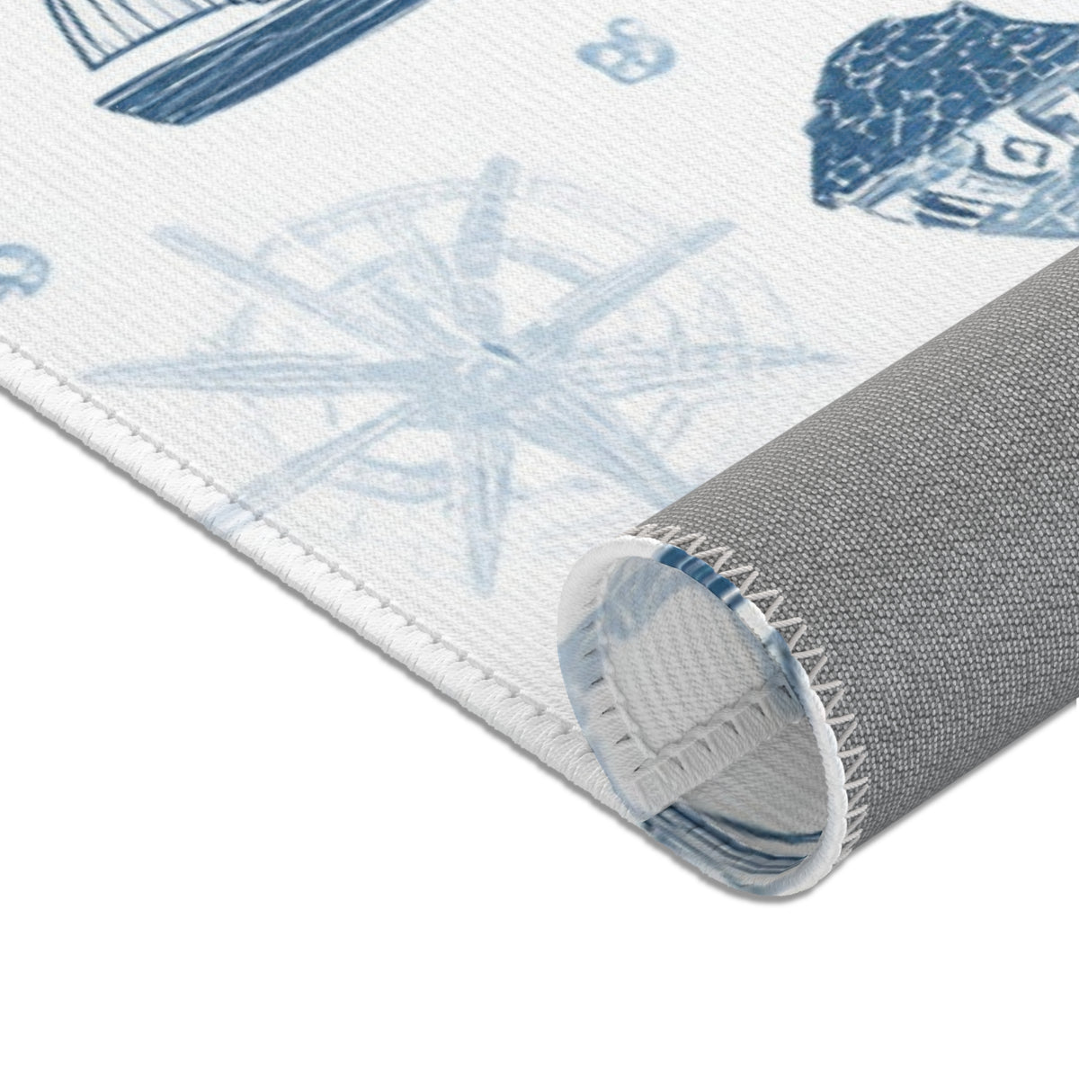 Navy nautical area rug in a baby boy nursery corner