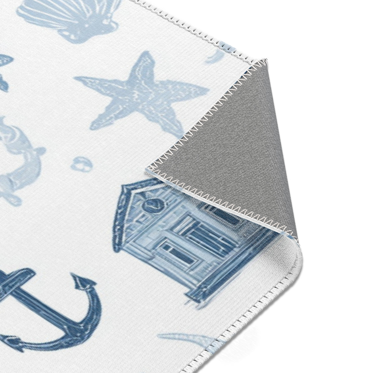 Navy nautical rug on a light wood floor