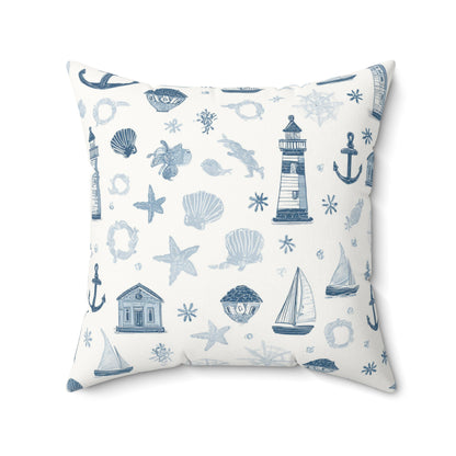Nautical print nursery pillow in a reading corner