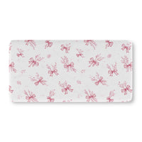 Crimson Bow fitted crib sheet on a nursery crib mattress