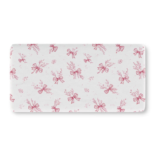 Crimson Bow fitted crib sheet on a nursery crib mattress