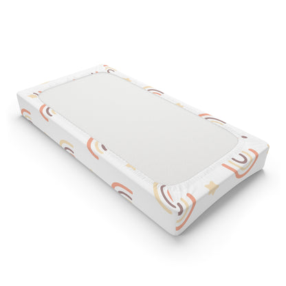 Changing pad cover with peach rainbows and cream stars on white