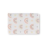 Peach Rainbow fitted crib sheet on a nursery crib mattress