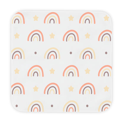 Peach Rainbow hooded baby towel wrapped around a baby
