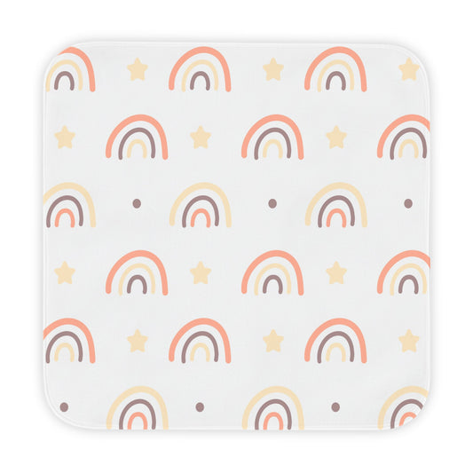 Peach Rainbow hooded baby towel wrapped around a baby