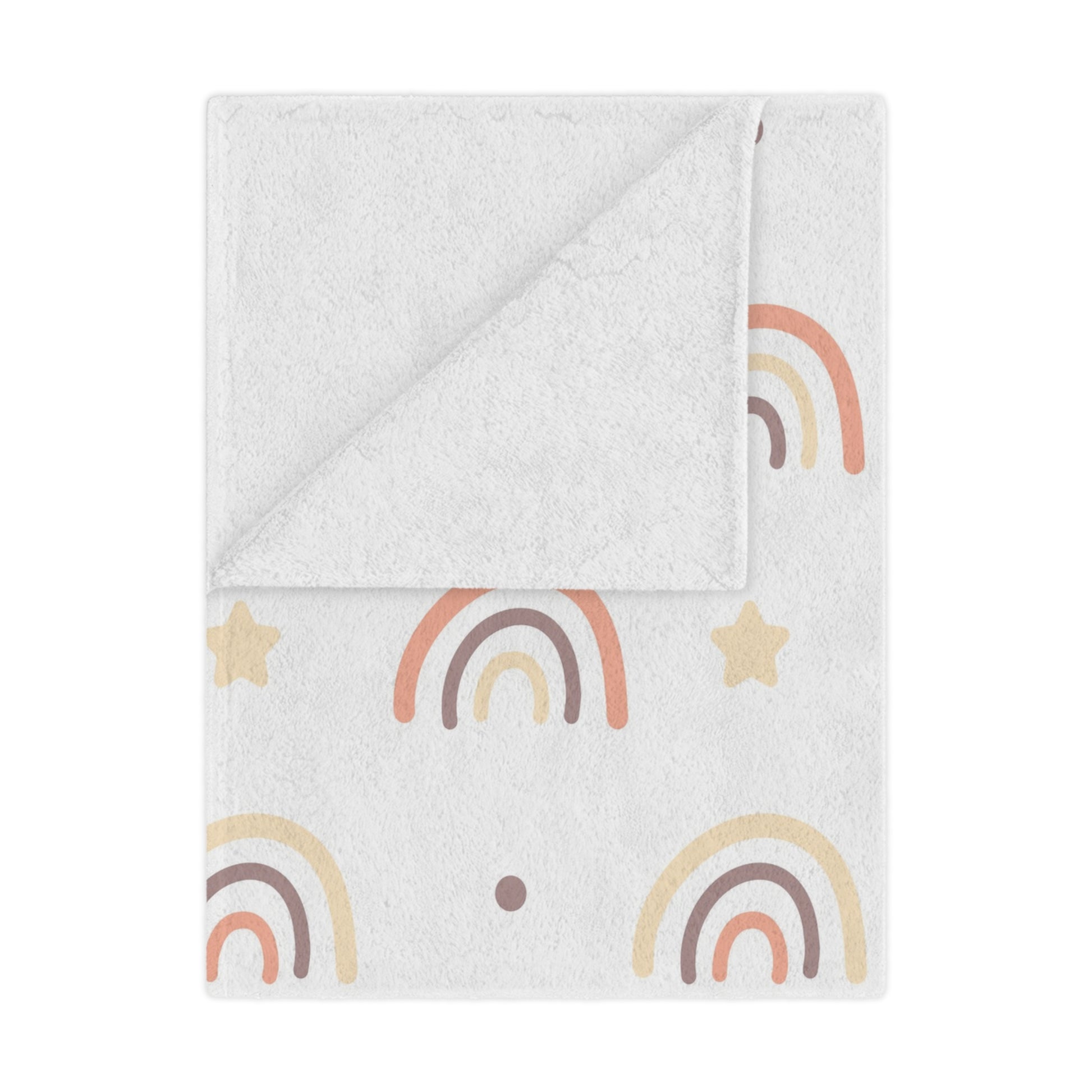Peach Rainbow minky baby blanket draped over a crib